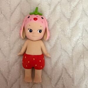 Strawberry-Themed Doll with Pink Hat and Red Shorts
